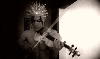 Paul Festa as Stringendo in Festa's silent-film comedy The Glitter Emergency